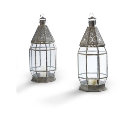 
	
		A PAIR OF NORTH AFRICAN GLAZED TIN OCTAGONAL SECTION LANTERNS,
		Modern 
		80cm high 
		
		Condition Report: 
		one of t