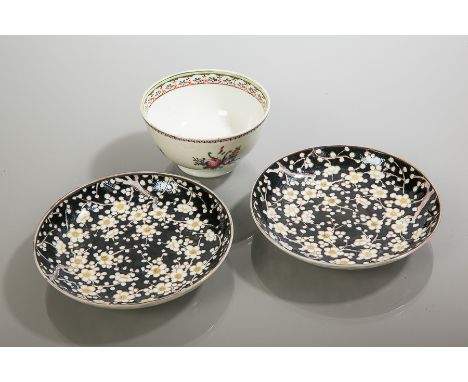 CHINESE FAMILLE ROSE WINE BOWL AND TWO FAMILLE NOIRE SAUCERS 
the wine bowl likely 18th century and decorated with floral spr