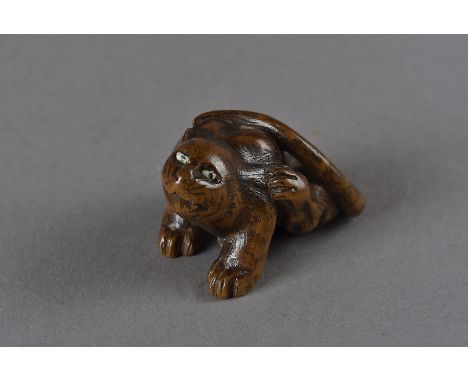 A Meiji period Japanese wood carved signed netsuke, modelled as a water rat, with bone inset eyes, carved fangs, and long swe