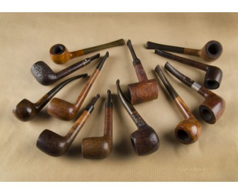 A collection of British briar estate pipes, including a Cavalier 995 sitter with logo marked stem, a City de Luxe Ferrule, Lo