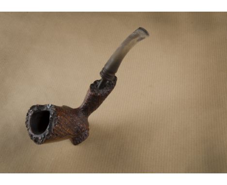 A Bjarne sitter briar estate pipe, free hand carved with sandblast and smooth panelled front, marked to underside, supported 