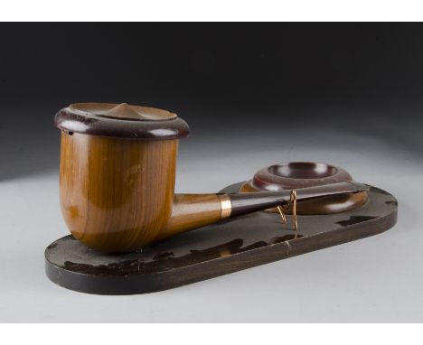 A mid 20th century presentation tobacco jar, modelled as a large pipe with hinged lid, and ashtray, bearing plaque to base 'P