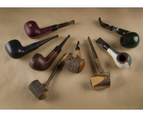 A mixed collection of estate pipes, four leather covered examples, two Longchamp, a Polo Sporting life, a Vuillard, red leath