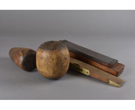 A collection of vintage wooden tools, including planishing hammers, woodcarving and other mallets, rebate planes, an oilstone