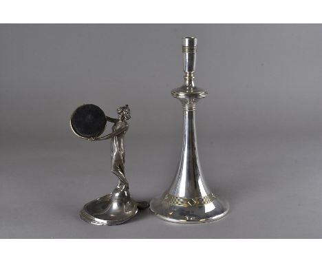 A WMF pewter pin cushion, modelled as an Art Nouveau maiden stood on a pin dish holding a tray with pin cushion aloft 19 cm H