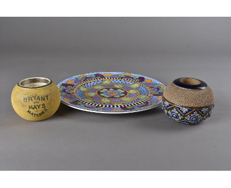 A Carltonware Bryant & May ceramic match striker, a Royal Doulton example, and a Royal Doulton Art Deco style plate (3) 