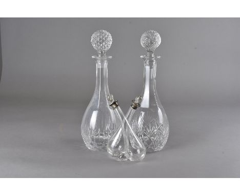 A large 19th century glass decanter 34 cm H, plus two later decanters with spare stopper and a silver mounted oil and vinegar