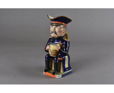 A Wilkinson Ltd. character jug, modelled as 'Earl Kitchener of Khartoum' officer seated with jug inscribed "Bitter for the Ka