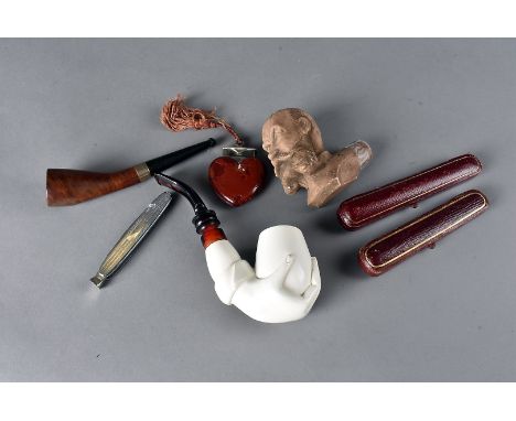 A small quantity of miscellaneous smoking items, comprising a French briar Smokarol pipe, a clay mask head pipe, a novelty li