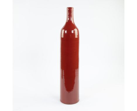 Tall tightly stylised red glazed ceramic vaseHoge strak gestileerde rood geglazuurde keramieken vaasH 64.5 cm