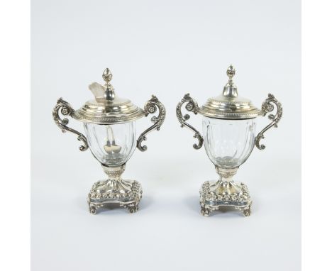 Ornate sugar set consisting of 2 beautifully cut crystal glasses with richly worked silver feet on 4 scroll feet, mounts with