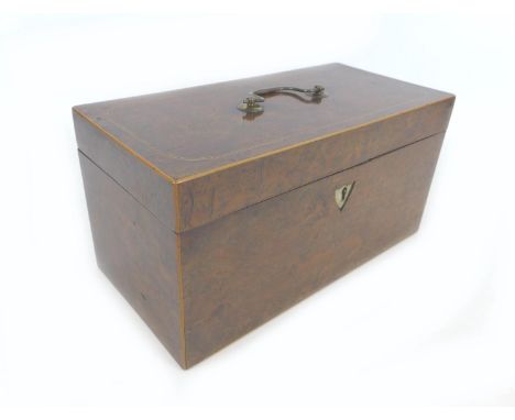 A 19th century burr walnut tea caddy, with boxwood inlays, its interior with attached note '..from Grandmother', a later glas