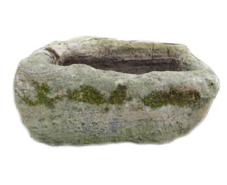A limestone trough planter, of rustic rectangular form with carved basin, 73 by 47 by 39cm high. 