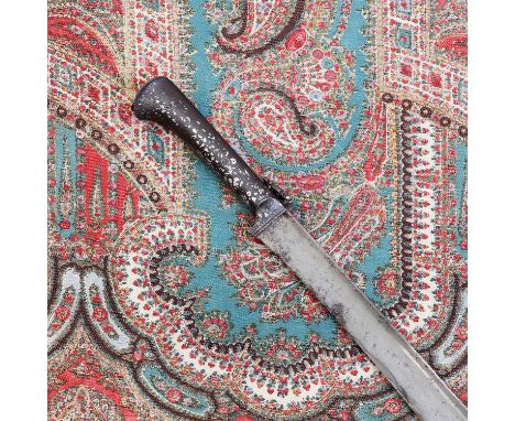 An Ottoman yataghan, 18th century, with an unusual silver-decorated steel hilt, set with two lanyard lockets, the recurved bl