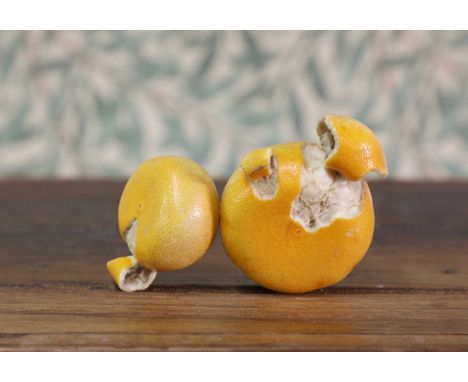 An ivory okimono,Meiji period (1868-1912), Japanese, in the shape of two peeled oranges, details depicted realistically, 9.5c