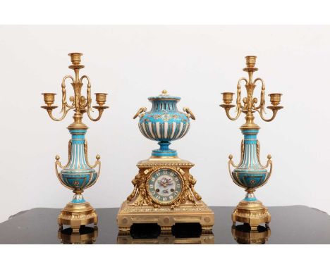 A gilt-bronze and Sèvres-style porcelain clock garniture,c.1880, the clock surmounted by a Sèvres-style urn and cover, decora