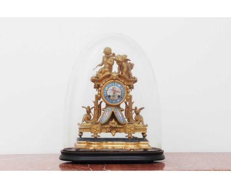 A French gilt-cased mantel clock,c.1870, of neoclassical design with cherubs and doves, inset with porcelain Sèvres-style pla