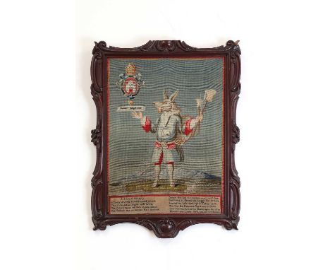 An embroidered picture,19th/20th century, entitled 'Manners Maketh Man', depicting a standing figure with an ass's head above