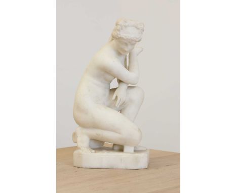 After the antique, an alabaster sculpture of the crouching Venus,20th century, seated on an urn, raised on a rippled base, 36