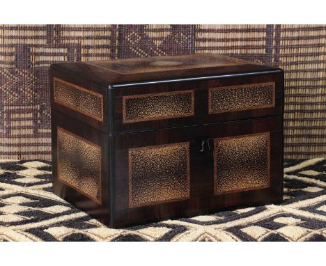 An ebonised and palmwood veneered box,19th century, Continental, the hinged lid with an embossed leather panel to the interio