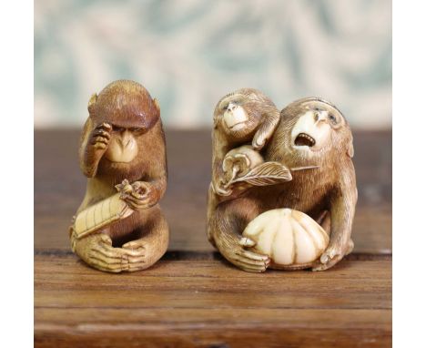 An ivory okimono,Meiji period (1868-1912), Japanese, carved with a seated monkey playing with an inro, signed 'Tomokazu' to b
