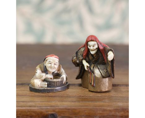 A wooden netsuke,Meiji period (1868-1912), Japanese, of Shojo, with red hair and gilt lacquered robes, his face, hands and fe