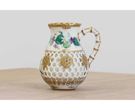 A Royal Worcester reticulated jug, late 19th century, of baluster form with honeycomb reticulation, painted in gilt decoratio