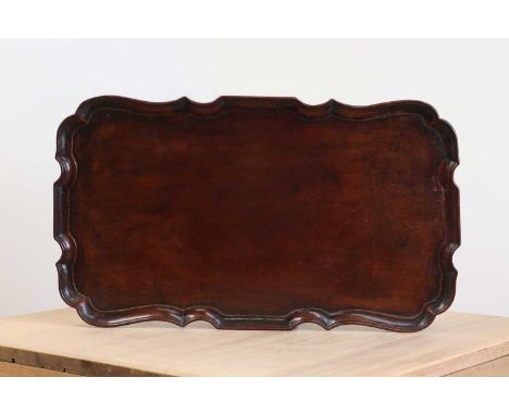 A George III mahogany tray,c.1780, of rectangular form with a piecrust moulded edge,62cm wide36cm deep2cm highCondition repor