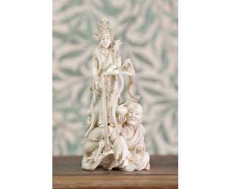 An ivory okimono,Meiji period (1868-1912), Japanese, of kwannon wearing elaborate beaded jewellery and floating long robes, w