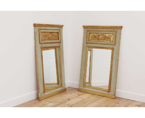 A pair of painted and parcel-gilt mirrors, of recent manufacture, in the French trumeau style, each set with a relief-cast pl