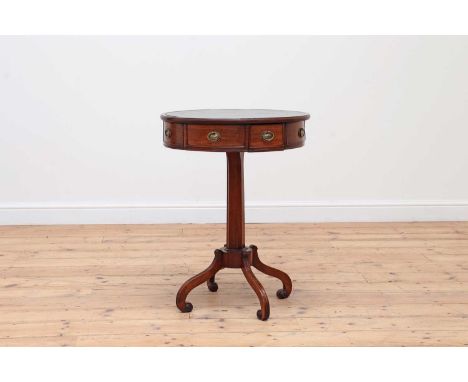 A small Regency mahogany drum table,19th century, the leather inset top over four frieze drawers interspersed with dummy draw