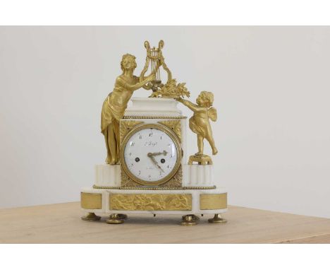An ormolu and white marble eight-day mantel clock,19th century, French, the white enamel dial inscribed 'Le Roy', set with Ro