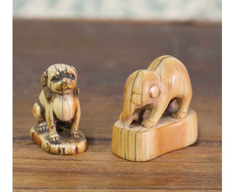 An ivory netsuke,Edo period (1603-1867), Japanese, of an elephant on a shaped plinth, 4cm long,together with another, of a Bu