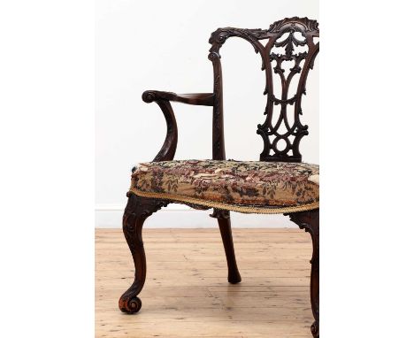 A George III Chippendale-style mahogany elbow chair, second half of the 19th century, with a scrolling acanthus-carved rail, 