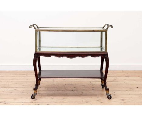 A French walnut and brass patisserie trolley,19th/20th century, with light damages,101cm wide52cm deep90cm highProvenance: Br