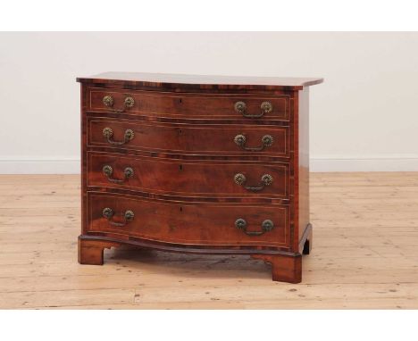 A George III serpentine mahogany chest of drawers,with boxwood stringing and satinwood crossbanding, the shaped top over four