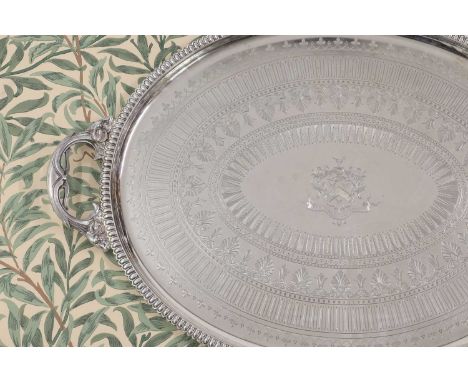 A large Victorian silver tray,by Fredrick Elkington, Birmingham 1874,the oval tray with a gadrooned edge and with ram’s head 