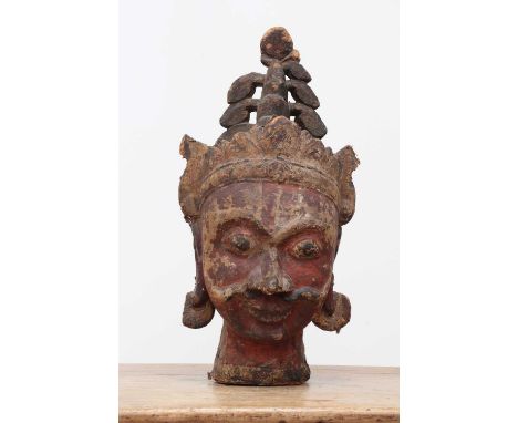 A carved wooden, canvas and polychrome-decorated puppet head,20th century, possibly Indian, depicting a Hindu god,30cm wide35