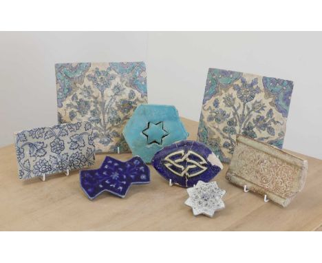 A pair of Iznik pottery tiles,possibly 17th century, each decorated in blue and turquoise with foliate designs,20 x 20cm,toge