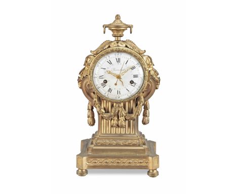 A late 18th Century French ormolu mantel clock with centre seconds and concentric dateBouchetSurmounted by an urn finial over