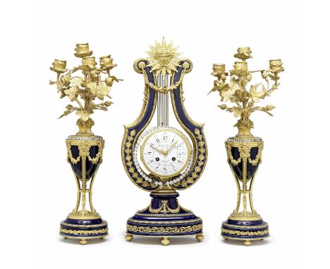 A 19th century porcelain ormolu and glass jewelled lyre clock garnitureHowell &amp; James Ltd, To the Queen, 5,7,9 Regent Str