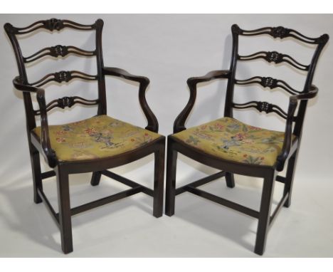 Pair of 19th century mahogany Chippendale style elbow chairs with carved and pierced ladder backs and needlework seats.