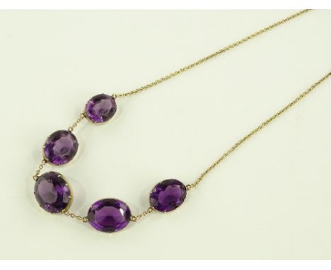 A Victorian graduated amethyst and gilt metal drop necklace, largest setting diameter 20mm.