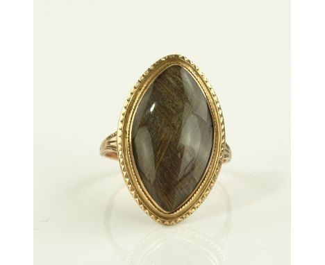 A Georgian unmarked gold marquise shaped memorial ring, hair panel under domed crystal, panel height 25mm, size P.