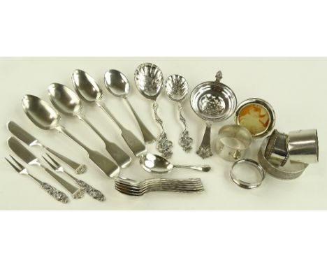 A group of silver items including napkin rings, caddy spoon, miniature photo frame, etc.