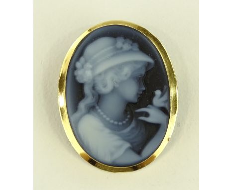 A 9ct gold framed relief carved agate panel brooch, height 32mm.