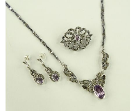 A group of silver amethyst and marcasite jewellery.