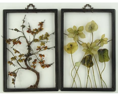 A pair of Chinese carved jade and hardstone floral ornaments in stained wood frames, height 47cm.