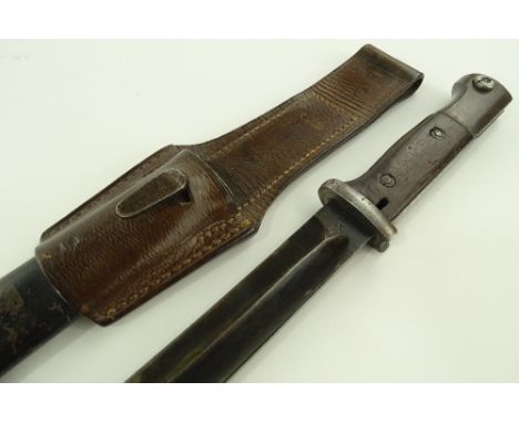 An early 20th century bayonet, metal scabbard with leather frog, blade length 25cm.