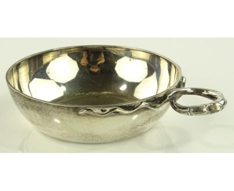 A Garrard silver wine tasting bowl with cast serpent handle, London 1973, diameter 9cm.